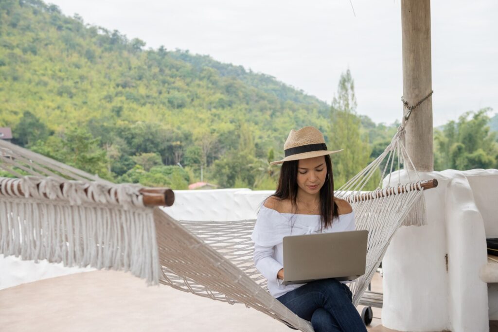 young-woman-enjoys-laptop-Balance-Remote-Work